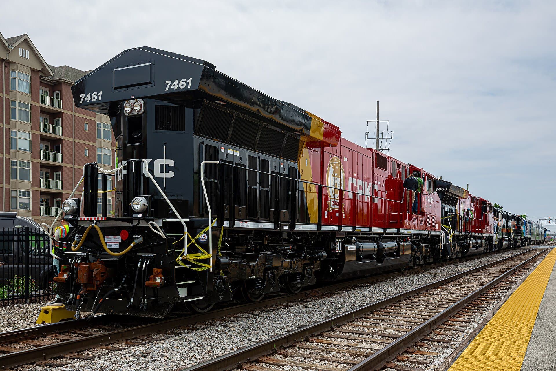 A freight train passes the platform in Franklin Park